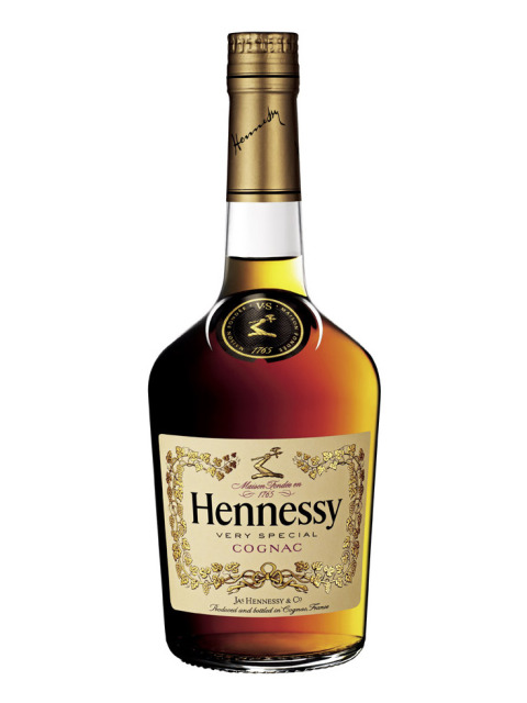 A bottle of Hennessy VS cognac, featuring a rich amber liquid, a gold and black label with ornate detailing, and a corked neck with a gold cap, standing upright against a plain background.