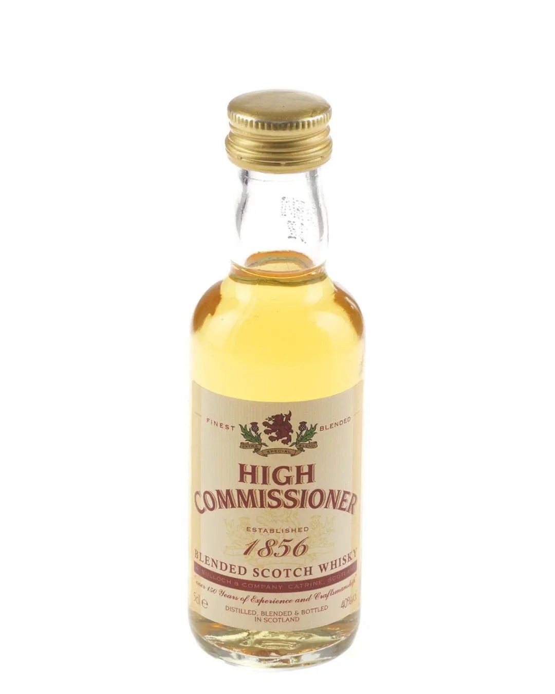 Small glass bottle of High Commissioner Blended Scotch Whisky, 5 cl, featuring a gold cap, yellow liquid, and a cream label with red and gold accents.