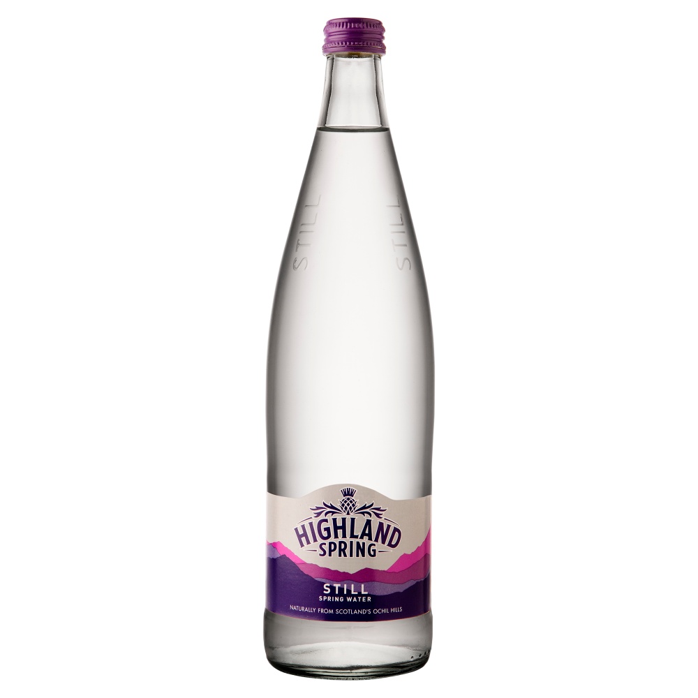 Clear glass bottle of Highland Spring still water, featuring a purple and white label with the brand name and "Still" prominently displayed, holding 750 ml of water.