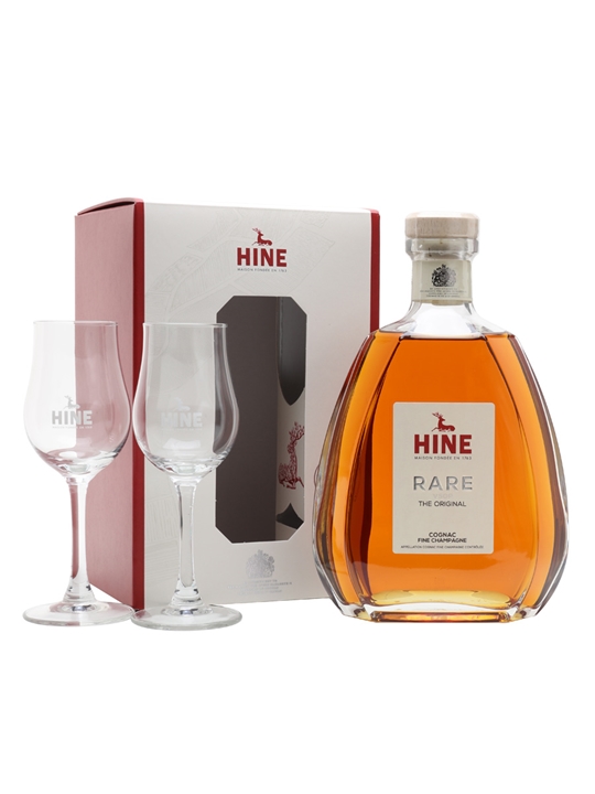 Hine Rare VSOP Cognac Gift Pack featuring a distinctive amber bottle with a cork stopper, accompanied by two elegant tasting glasses, all presented in a stylish red and white box.