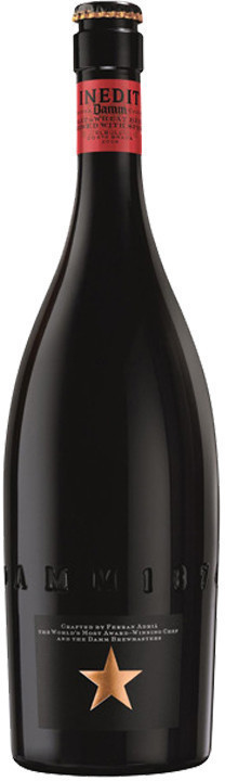 Twelve 750 ml bottles of Inedit Damm Wheat Beer, featuring a sleek black bottle with a red cap and a prominent gold star logo, arranged in a multipack.