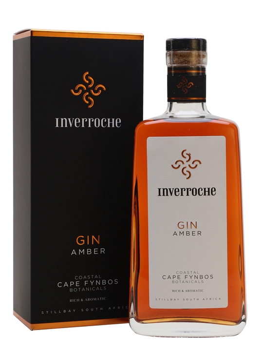 Clear glass bottle of Inverroche Amber Gin with a cork stopper, featuring an amber liquid, and a black box with gold and white branding, highlighting "GIN AMBER" and "COASTAL CAPE FYNBOS BOTANICALS."