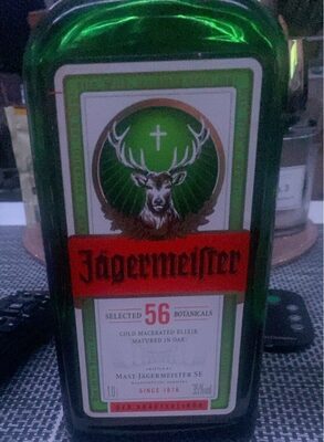 Green glass bottle of Jägermeister, featuring a prominent deer logo with a cross, red label stating "SELECTED 56 BOTANICALS," and a vintage design, 1 liter size.