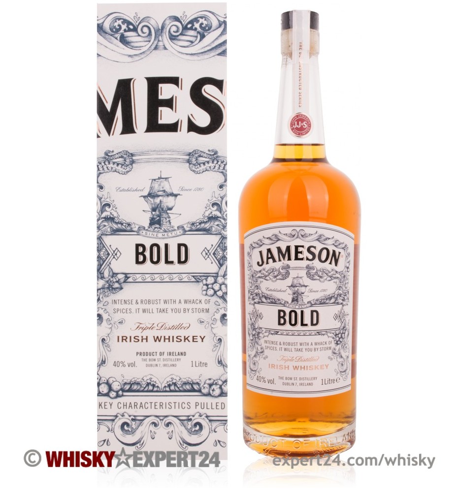 Jameson Bold Whiskey bottle features a clear glass design with a cork stopper, showcasing a rich amber liquid and a decorative label with bold text and intricate patterns.