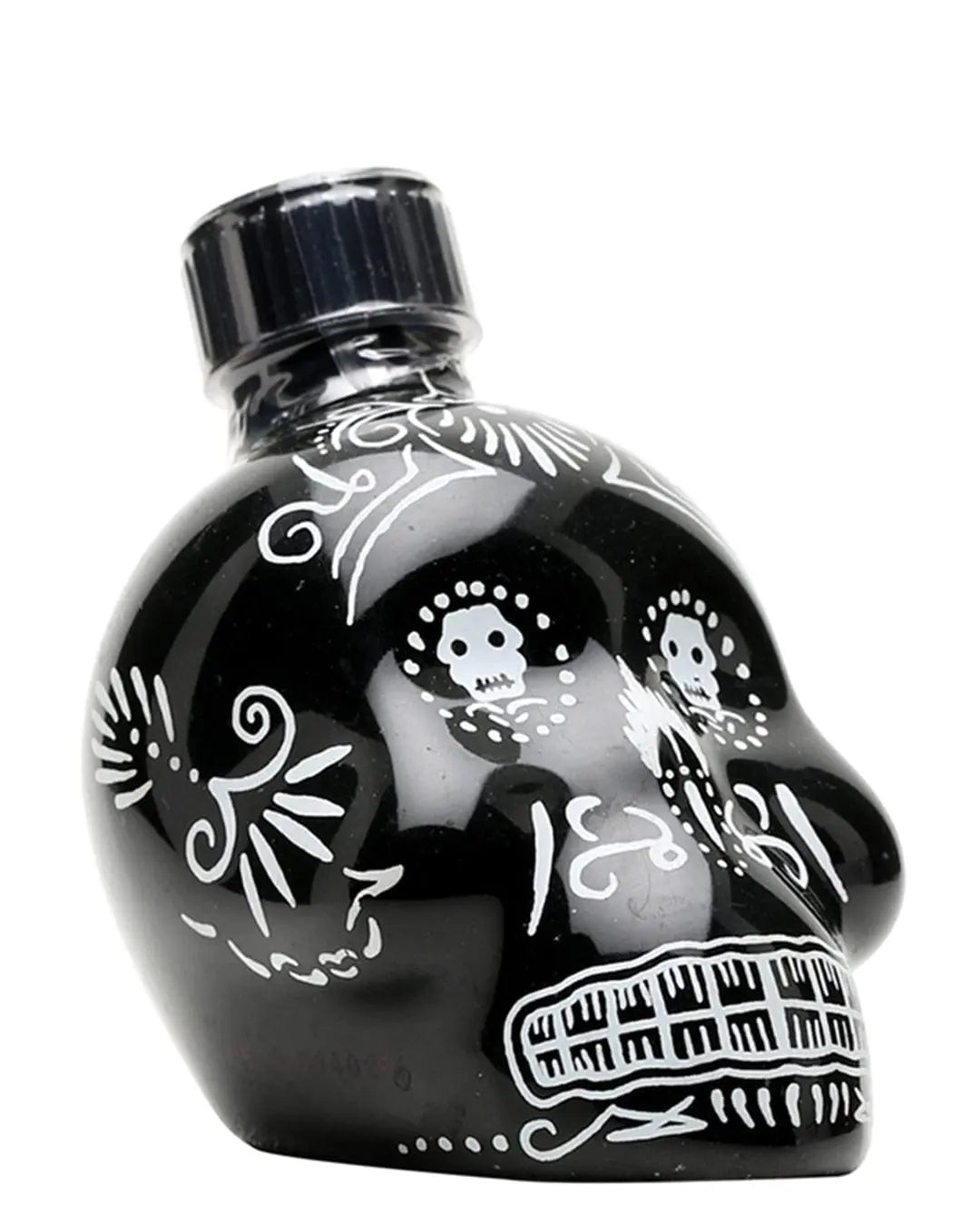 Black ceramic skull-shaped bottle with intricate white sugar skull designs, featuring a black cap, containing 5 cl of KAH Tequila Anejo.