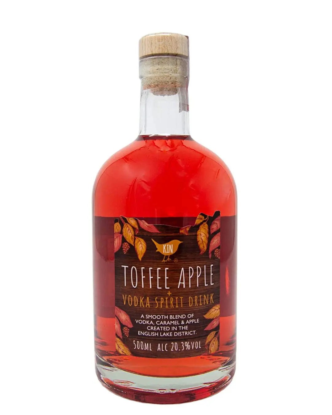 Clear glass bottle with a cork stopper, filled with vibrant red toffee apple vodka, featuring a decorative label with autumn leaves and text detailing its flavor and alcohol content.