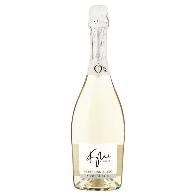 Clear glass bottle of Kylie Minogue 0% Sparkling Blanc, featuring a sleek design, white label with gold accents, and a cork top, packaged in a six-pack.