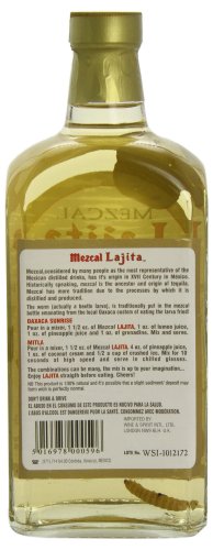 Lajita Reposado Mezcal bottle, 70 Cl, features a clear glass design with a light amber liquid, a cork stopper, and a label with detailed text and branding in red and black.