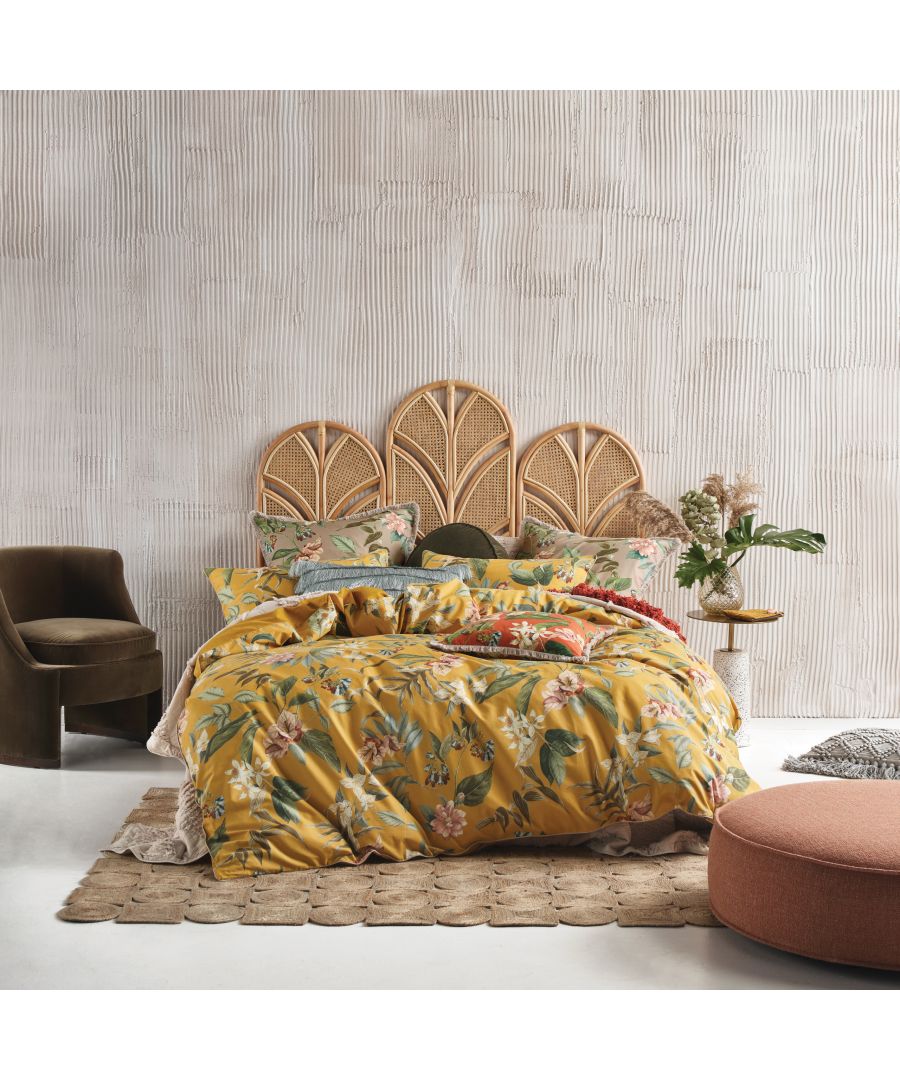 Linen House Anastacia double duvet cover set features a vibrant floral pattern in yellow, pink, and green, made from soft cotton, styled with coordinating pillows and a textured backdrop.