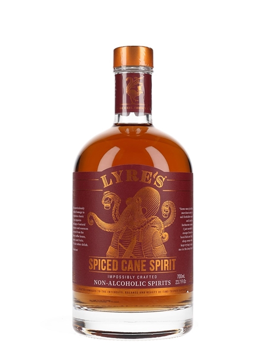 Amber liquid in a clear glass bottle with a cork stopper, featuring a bronze label with "LYRE'S SPICED CANE SPIRIT" in bold lettering and an octopus illustration.