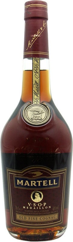 Martell VSOP Cognac bottle with a rich amber color, featuring a gold and dark red label, embossed medallion, and a decorative gift box.