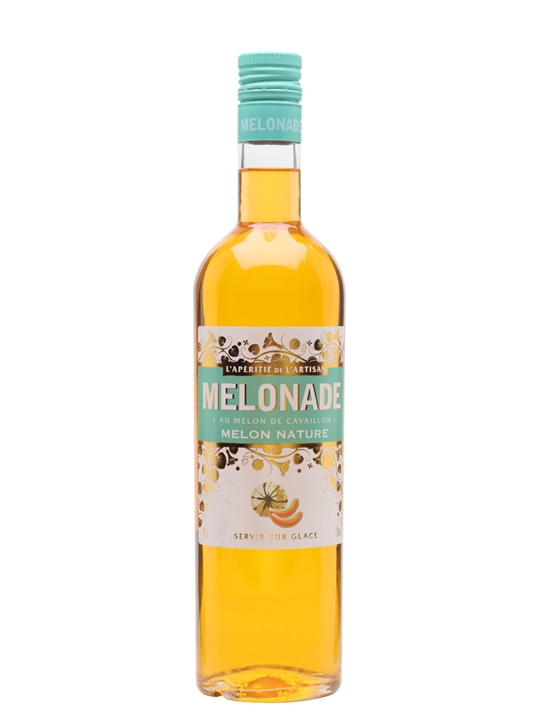 A clear glass bottle filled with a golden-yellow liquid, featuring a turquoise cap and a decorative label with floral patterns and the text "MELONADE au MELON DE CAVALON."