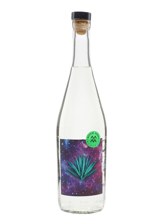 Clear glass bottle with a cork stopper, featuring a vibrant label depicting a blue agave plant against a colorful galaxy background, labeled "Mezcal Verde, 70 Cl" by Mezcal Amaras.