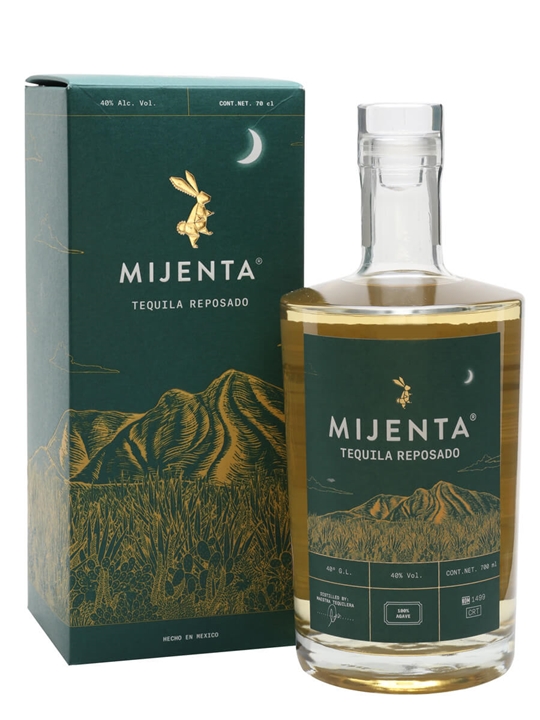 Mijenta Reposado Tequila bottle with a clear glass design, golden liquid, and a green box featuring gold mountain and rabbit illustrations.