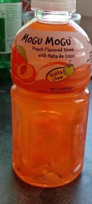 Mogu Mogu peach drink in a transparent plastic bottle, featuring a vibrant orange liquid and a pink label with the brand name and "nata de coco" text.