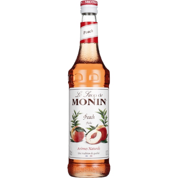 Clear glass bottle of Monin Peach Syrup, 70 cl, featuring a white label with red and green accents, showcasing a peach illustration and the brand name prominently.