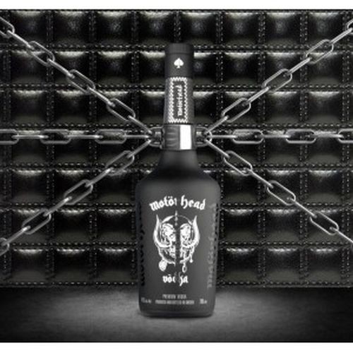 Black glass bottle of Motörhead Vodka Batch 2, featuring a silver label with a skull and crossed axes design, set against a textured black background with chains.
