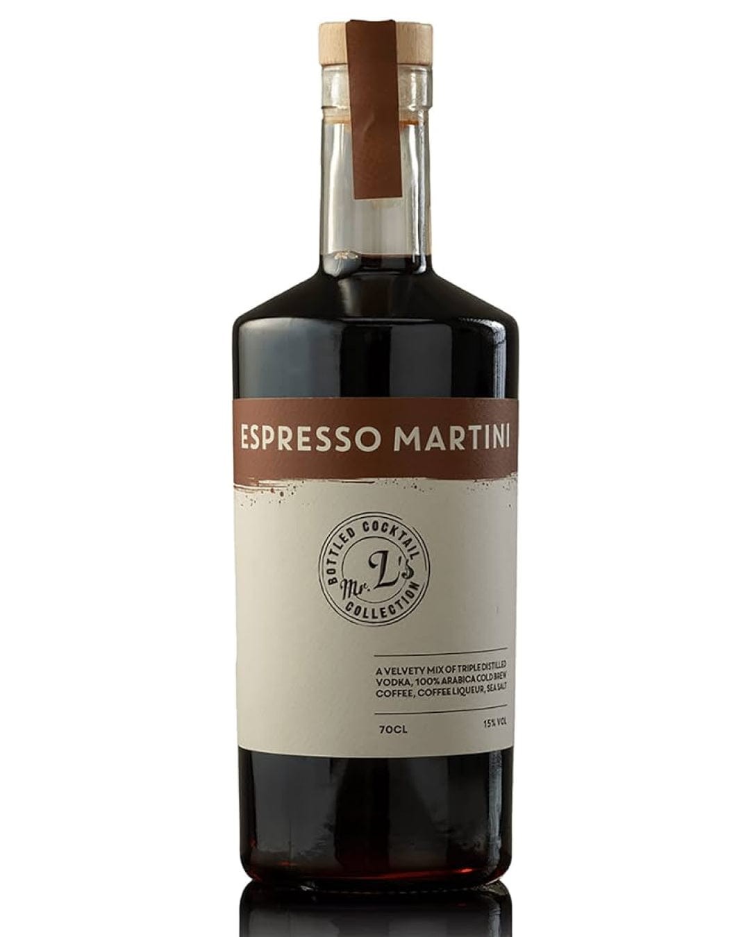 A dark glass bottle with a brown label reading "Espresso Martini" and a brown paper tag, featuring a sleek design and a cork stopper, containing 70 cl of cocktail.