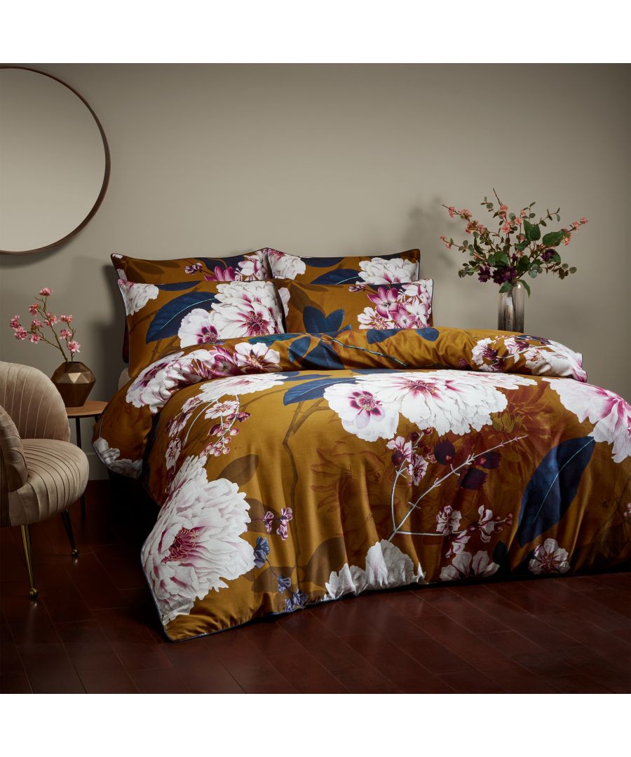 Multicolour cotton duvet cover set featuring large floral patterns in shades of white, pink, and blue on a rich mustard background, complemented by piped edges, suitable for a super king bed.