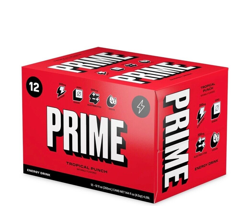 Red cardboard multipack box containing 12 cans of Prime Tropical Punch Energy Drink, featuring bold white text and various energy symbols on the packaging.