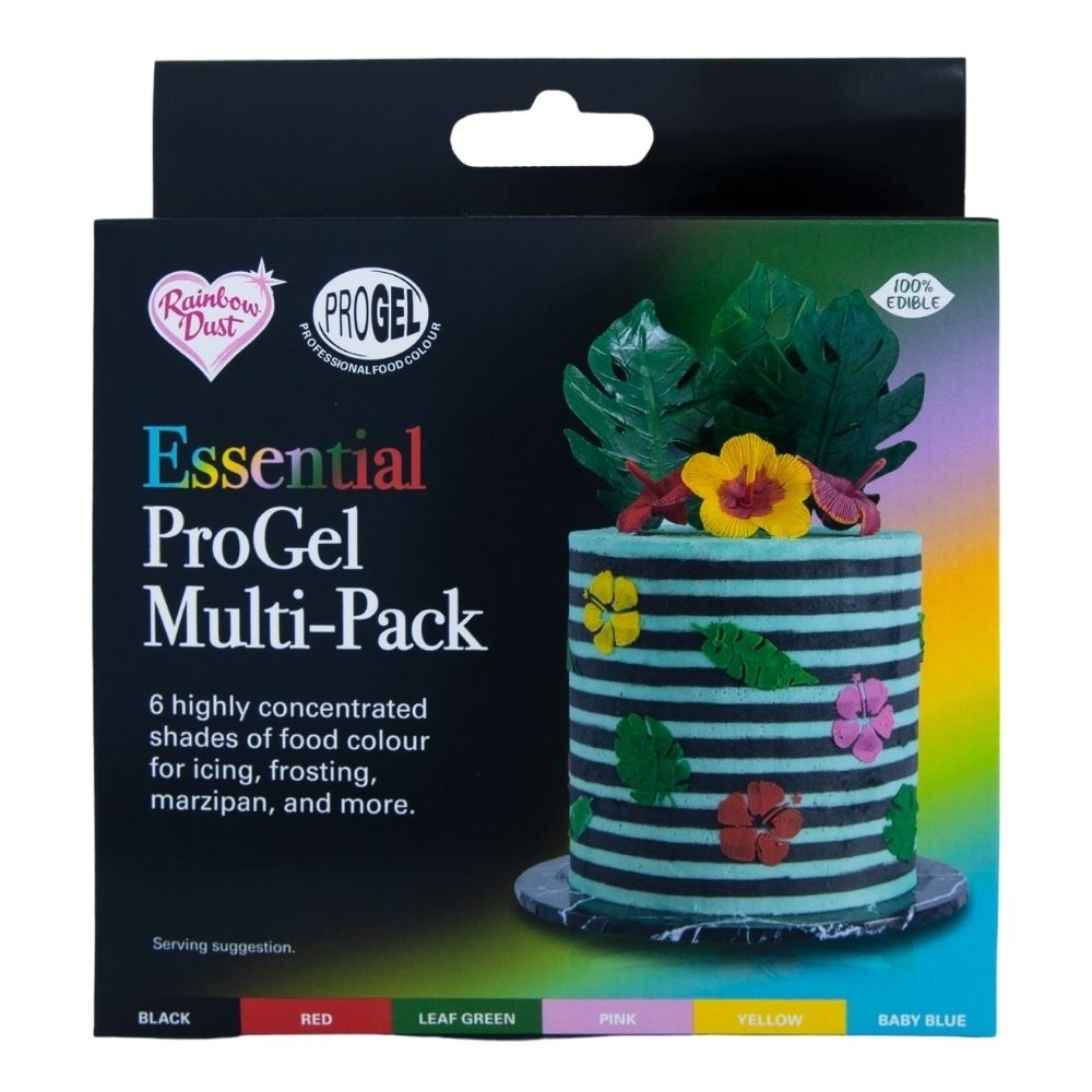 Six vibrant ProGel food coloring tubes in red, leaf green, pink, yellow, baby blue, and black, packaged in a colorful box featuring a decorated cake with tropical leaves and flowers.