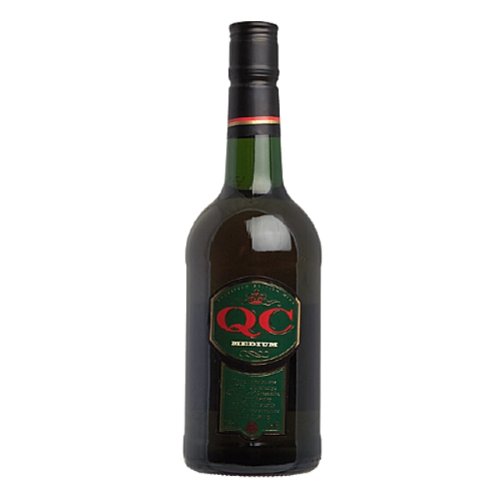 Green glass bottle of QC Cream, 70 cl, featuring a prominent red and green label with gold accents and a black screw cap.