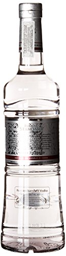 Clear glass bottle of Russian Standard Platinum Vodka, 70 cl, featuring a silver label with intricate designs and a sleek silver cap, showcasing its premium quality.