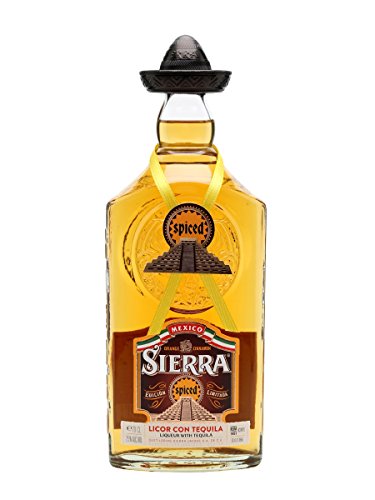 Clear glass bottle with a distinctive black sombrero-shaped cap, filled with amber-colored Sierra Spiced Tequila Liqueur, featuring a yellow ribbon and a decorative label.
