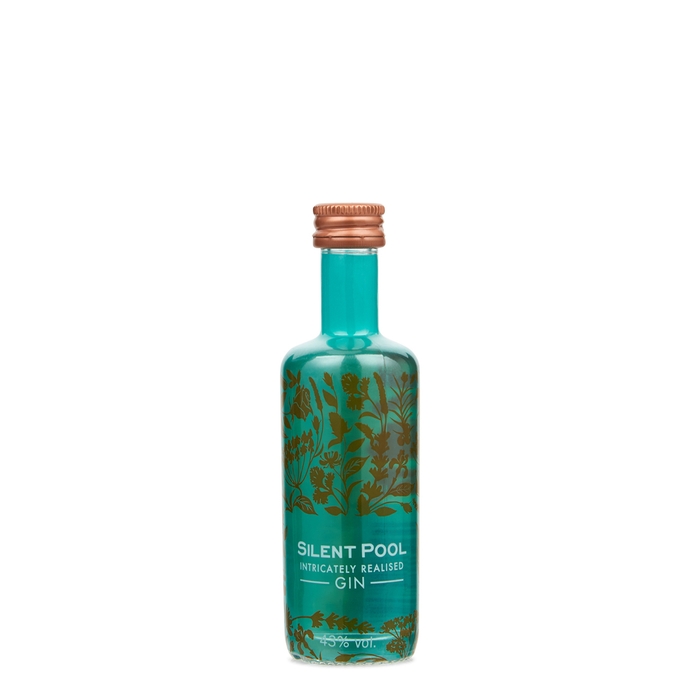 Teal glass miniature bottle of Silent Pool Gin, featuring intricate gold botanical designs and a copper screw cap, containing 5 cl of gin at 43% ABV.