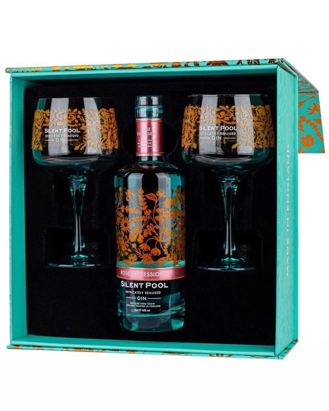 Elegant gift set featuring a 70 Cl bottle of Silent Pool Rose Expression Gin and two ornate, floral-etched glass goblets in a vibrant turquoise box.