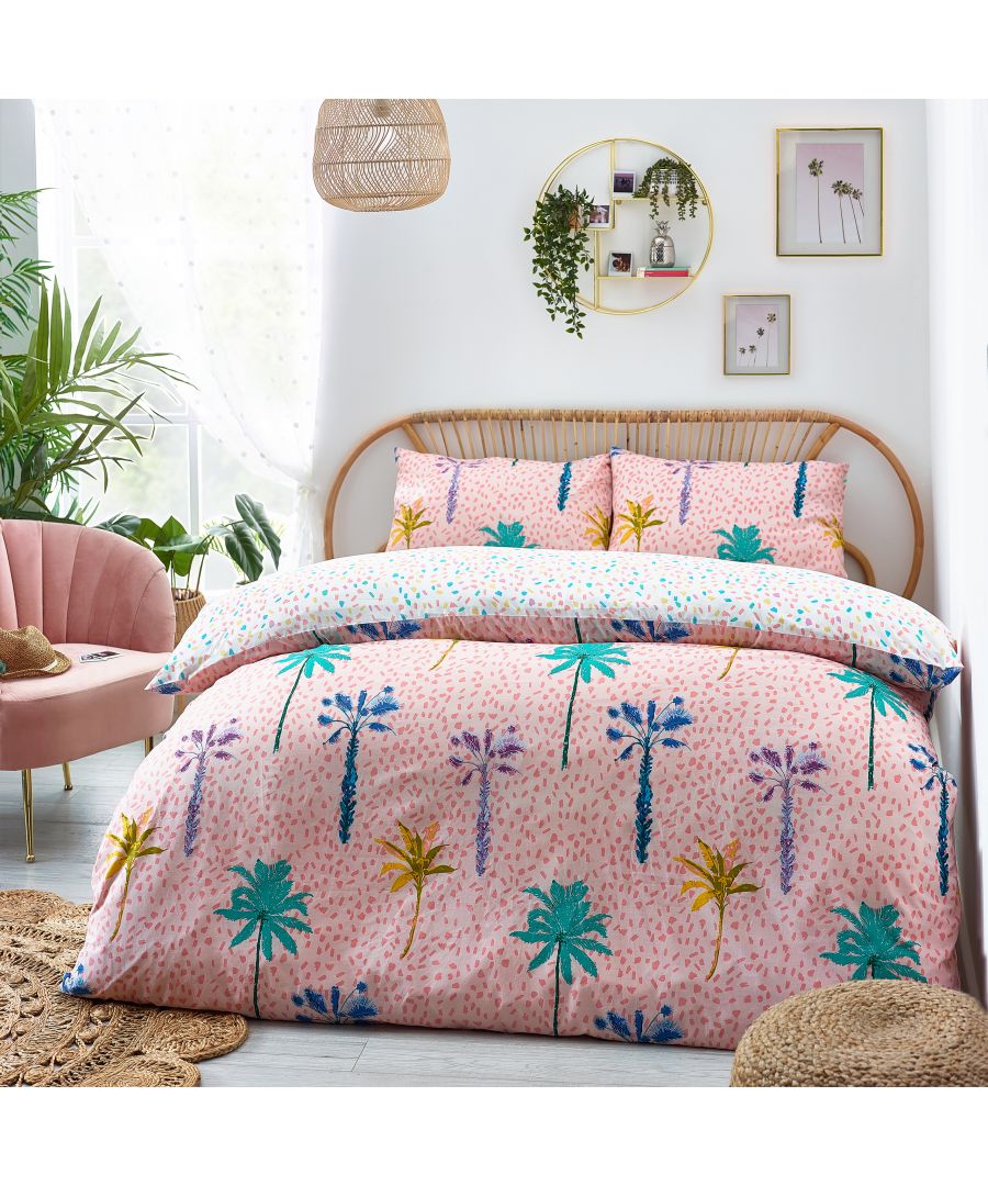Vibrant reversible duvet cover set featuring a blue and pink palm tree design, made from soft fabric, includes matching pillowcases, ideal for a stylish bedroom update.