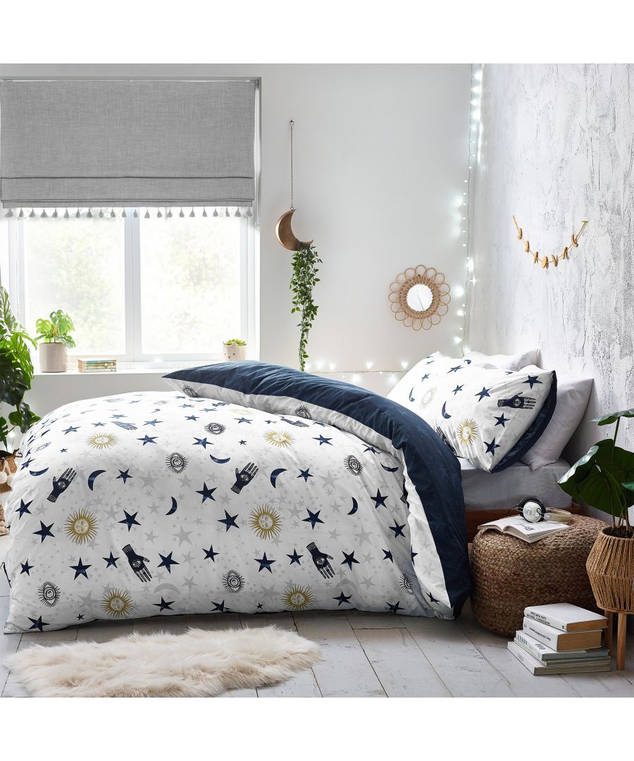 Multicolour cotton duvet cover set featuring abstract stargazer designs with celestial motifs, reversible with navy and white patterns, suitable for a single bed.