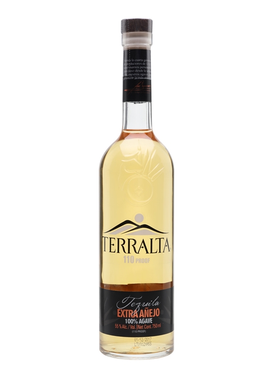 Clear glass bottle of Terralta Extra Añejo 110 Proof Tequila, featuring a golden liquid, black and gold label, and a wooden cork stopper.
