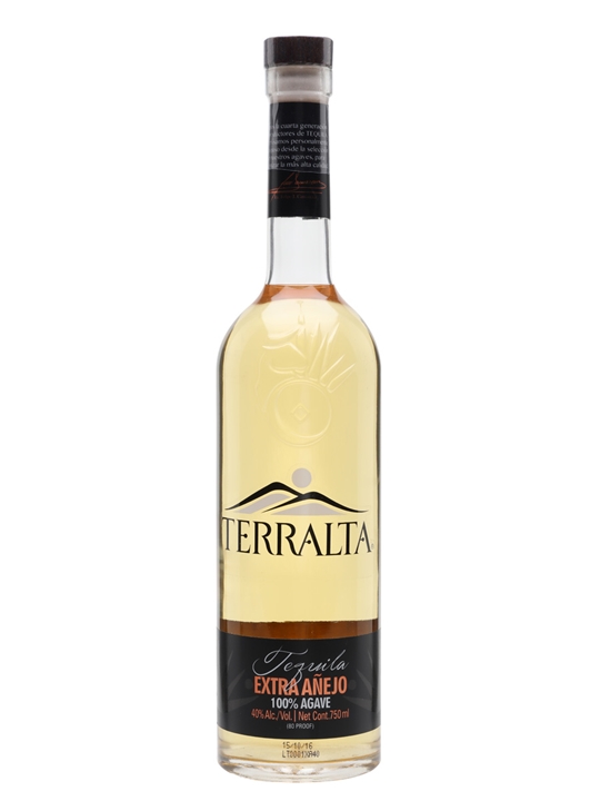 Clear glass bottle of Terralta Extra Añejo Tequila, 75 cl, featuring a golden liquid, a black label with white text, and a wooden cork stopper.