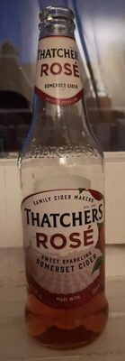 Thatchers Rosé Cider multipack featuring six 500 ml glass bottles, each with a pink label and a clear, sparkling pink liquid inside, set against a blurred background.