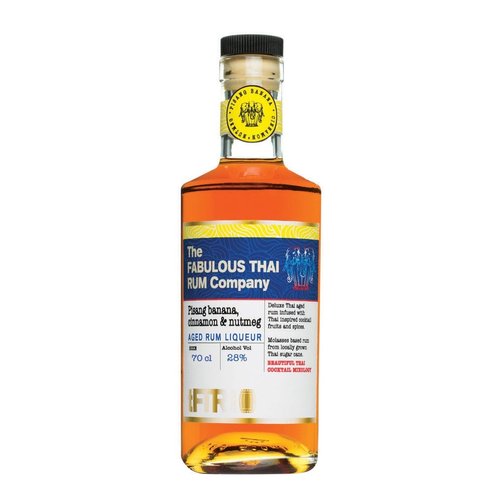 Amber-colored bottle of Pisang Banana, Cinnamon & Nutmeg Rum Liqueur with a yellow cap, featuring a blue and white label with text and logo, 70 cl, 28% alcohol by volume.
