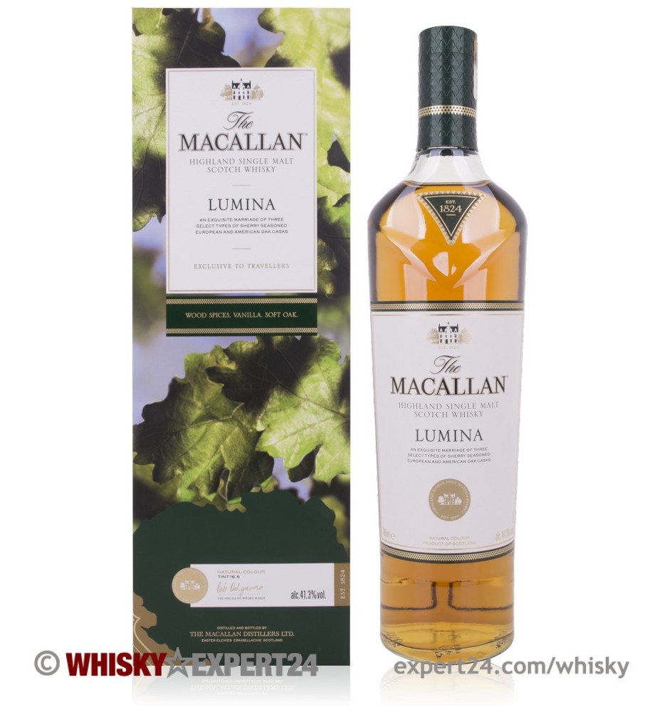 Clear glass bottle of The Macallan Lumina Whisky, 70 Cl, featuring a light amber liquid, elegant label with gold accents, and a wooden box adorned with green grape leaves.