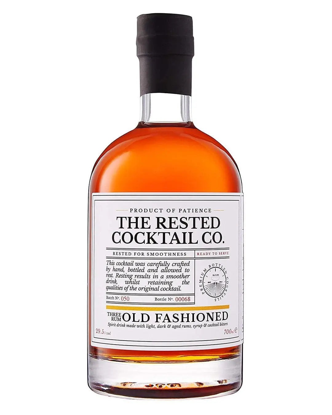 Amber-colored rum in a clear glass bottle with a black cap, featuring a white label that reads "The Rested Cocktail Co. Rum Old Fashioned," highlighting its smoothness and ready-to-serve quality.