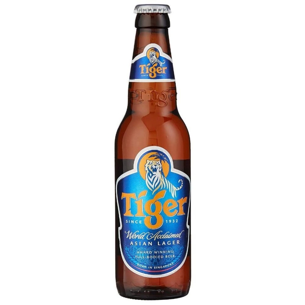 Tiger Premium Lager beer bottle in a 24-pack, featuring a clear glass design, amber liquid, blue and gold label with a tiger logo, and a silver cap.