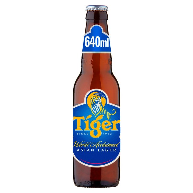 Brown glass bottle of Tiger Premium Lager Beer, 640 ml, featuring a blue and yellow label with a lion logo and text "World Acclaimed Asian Lager."