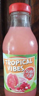 Clear glass bottle with a red cap, filled with pink guava and lychee drink, featuring a colorful label that reads "Tropical Vibes Guava & Lychee" with fruit illustrations.