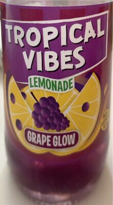 Bright purple bottle featuring "Tropical Vibes" branding, with a label displaying yellow lemons and grapes, indicating a lemonade flavor in a 300 ml multipack.