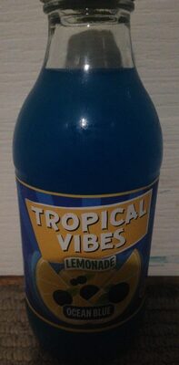 Bright blue lemonade in a clear glass bottle, featuring a vibrant label with "Tropical Vibes" and "Ocean Blue" text, showcasing a lemon graphic and tropical theme.