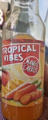 Clear glass bottle featuring a vibrant label with "Tropical Vibes" and "Mango Carrot" text, showcasing mangoes and carrots, filled with orange beverage.