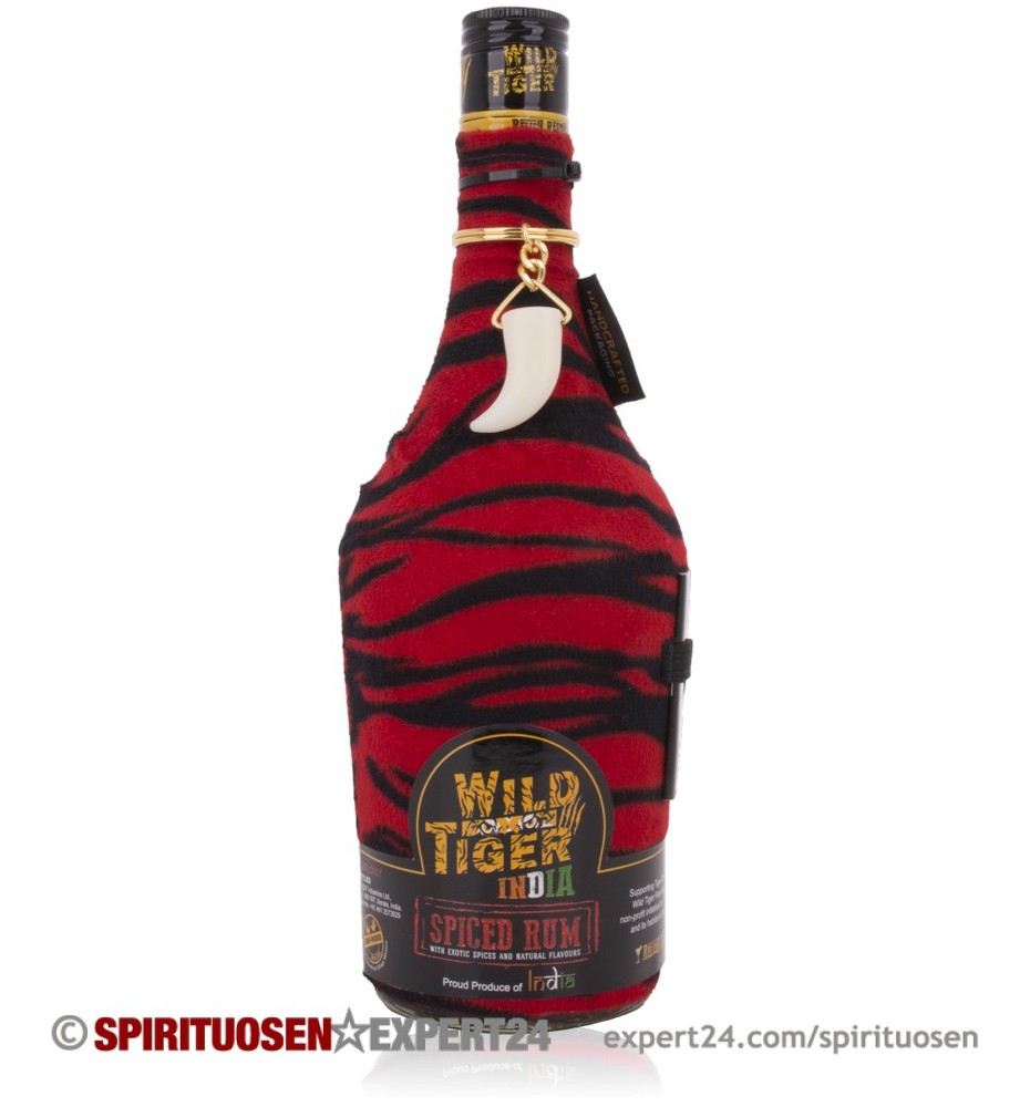 Wild Tiger Spiced Rum bottle features a unique red and black tiger stripe design, with a distinctive white ceramic tiger tooth pendant and bold black labeling.