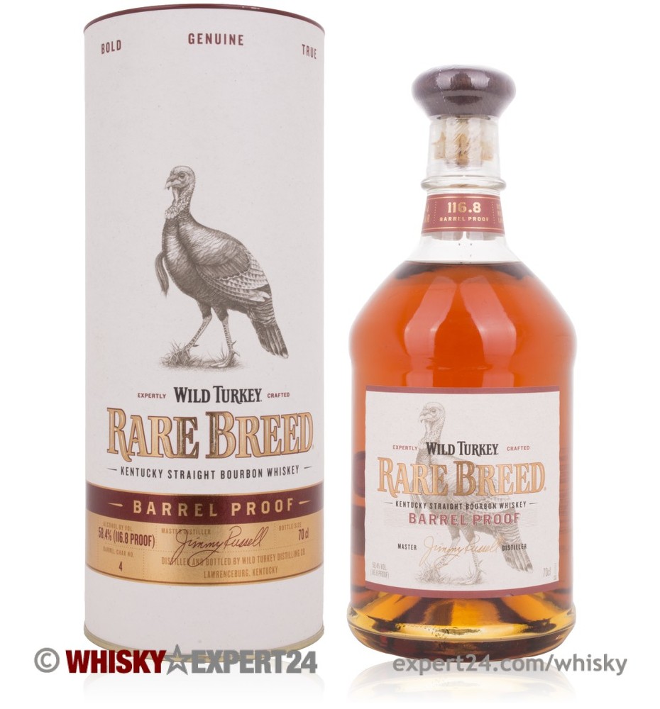 Amber whiskey in a clear glass bottle with a cork stopper, featuring a label with "Wild Turkey Rare Breed" and a turkey graphic, alongside a cylindrical cardboard tube.