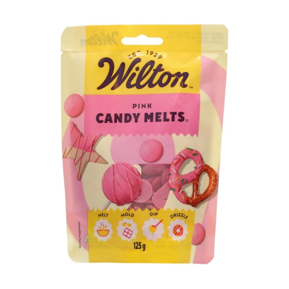 Bright pink candy melts in a 125g package by Wilton, featuring a playful design with candy shapes and a logo, ideal for melting, molding, dipping, and drizzling.