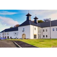 Falkirk Whisky Distillery Tour Experience, white building with twin peaked roofs, surrounded by green lawn and blue sky.