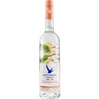 Grey Goose Essences bottle, clear with peach and rosemary graphics, orange cap, blue logo, 70cl vodka spirit drink.