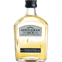 Small clear bottle of Jack Daniel's Gentleman Jack Whiskey with black cap and silver label.